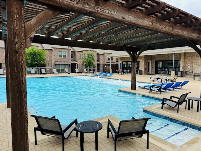 community pool featuring a patio, fence, and a pergola