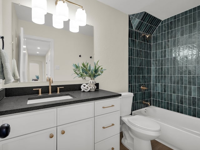 full bath featuring vanity, toilet, and tub / shower combination