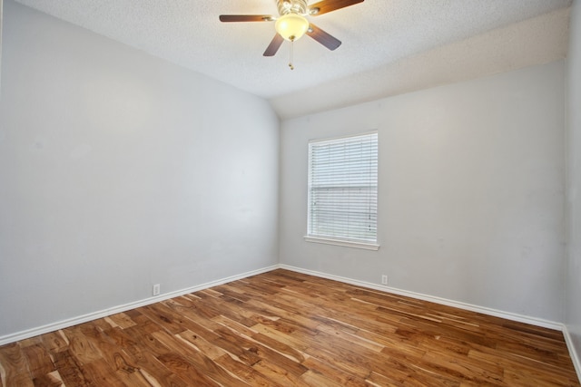 unfurnished room featuring baseboards, a ceiling fan, and wood finished floors