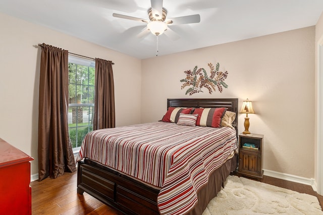 4705 El Salvador Ct, Arlington, TX 76017 - bedroom featuring a ceiling fan, baseboards, and wood finished floors