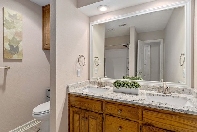 4705 El Salvador Ct, Arlington, TX 76017 - bathroom with double vanity, toilet, visible vents, and a sink