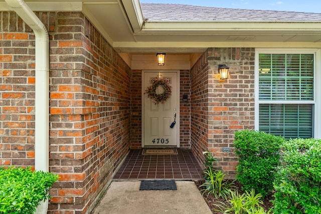 4705 El Salvador Ct, Arlington, TX 76017 - doorway to property with brick siding and roof with shingles