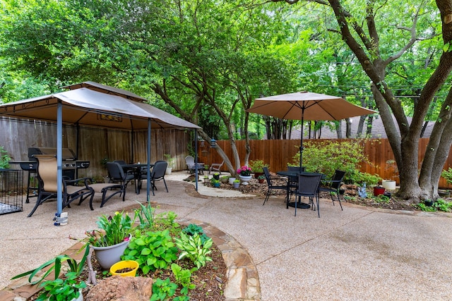 4705 El Salvador Ct, Arlington, TX 76017 - view of patio featuring a fenced backyard, outdoor dining area, and a gazebo