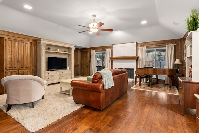 4705 El Salvador Ct, Arlington, TX 76017 - living area featuring dark wood finished floors, ceiling fan, vaulted ceiling, and a fireplace