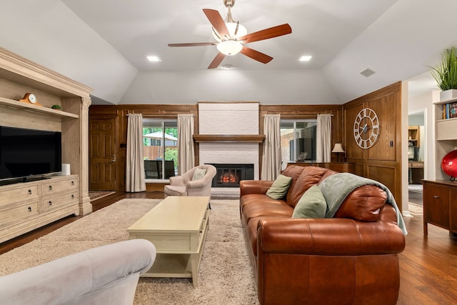 4705 El Salvador Ct, Arlington, TX 76017 - living room featuring ceiling fan, vaulted ceiling, a glass covered fireplace, and wood finished floors