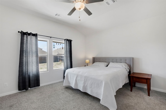carpeted bedroom with baseboards, visible vents, and lofted ceiling