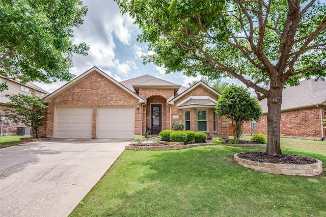 single story home with a garage, a front yard, driveway, and brick siding