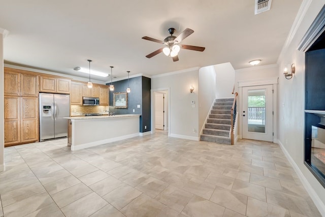 kitchen with visible vents, ornamental molding, tasteful backsplash, a ceiling fan, and appliances with stainless steel finishes