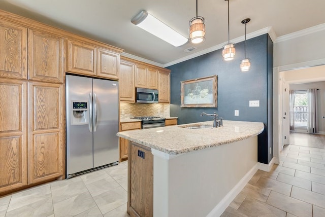 kitchen featuring stainless steel appliances, hanging light fixtures, ornamental molding, and a sink