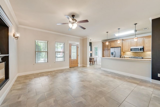 unfurnished living room featuring crown molding, a ceiling fan, and baseboards
