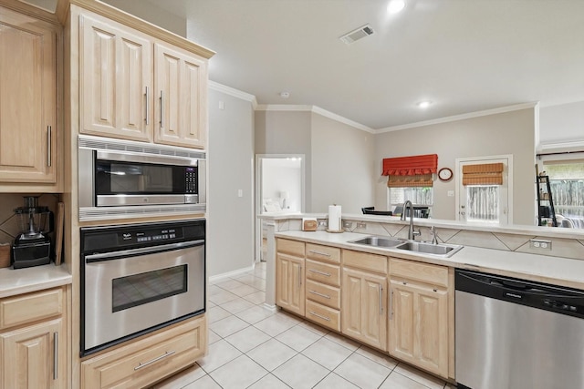 4833 Heber Springs Trl, Fort Worth, TX 76244 - kitchen featuring stainless steel appliances, a sink, light brown cabinets, crown molding, and plenty of natural light