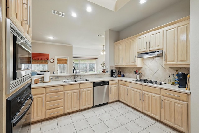 4833 Heber Springs Trl, Fort Worth, TX 76244 - kitchen with appliances with stainless steel finishes, a sink, under cabinet range hood, light brown cabinetry, and backsplash