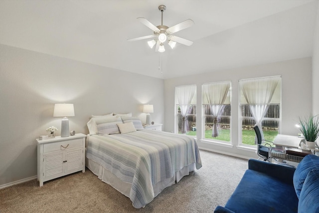 bedroom with light colored carpet, a ceiling fan, and baseboards