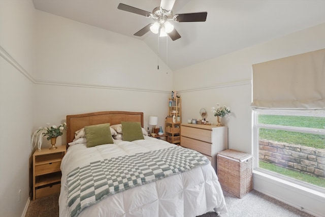 bedroom featuring a ceiling fan, lofted ceiling, and light carpet