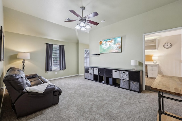 carpeted living area with baseboards, a ceiling fan, and visible vents