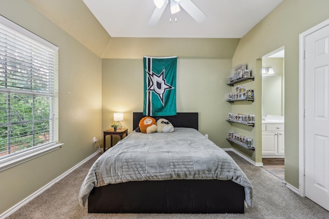 bedroom featuring baseboards, carpet flooring, connected bathroom, and ceiling fan