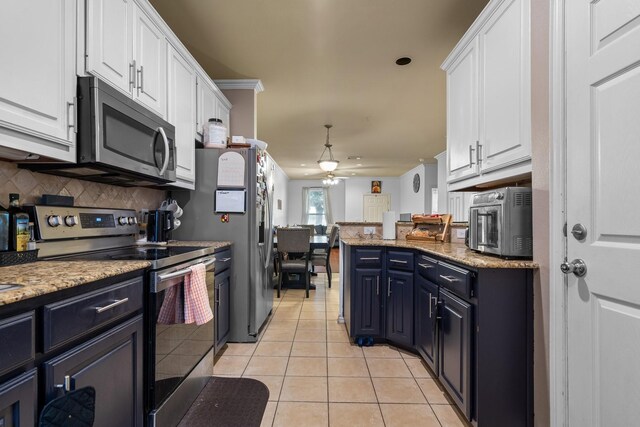 172 High School Dr, Lewisville, TX 75057 - kitchen featuring a ceiling fan, backsplash, white cabinets, stainless steel appliances, and light tile patterned flooring