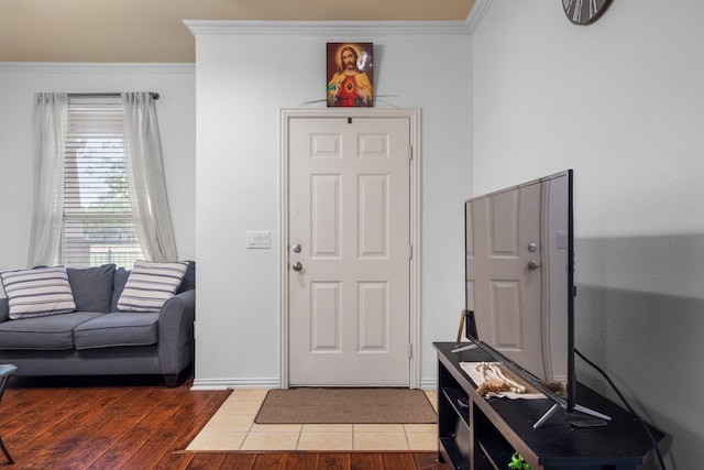 172 High School Dr, Lewisville, TX 75057 - entrance foyer with baseboards, ornamental molding, and wood finished floors