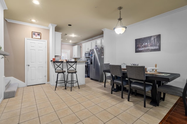 172 High School Dr, Lewisville, TX 75057 - dining area with baseboards, ornamental molding, recessed lighting, and light tile patterned flooring
