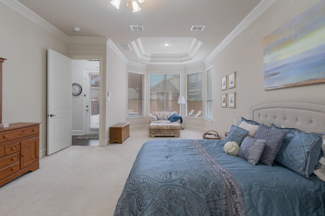 bedroom featuring crown molding, visible vents, a tray ceiling, and light colored carpet