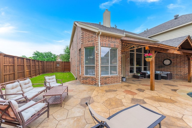 view of patio / terrace with an outdoor living space and a fenced backyard