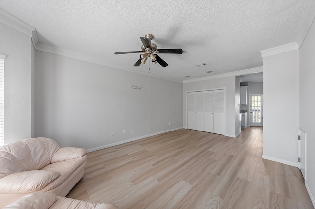 living area featuring crown molding, a textured ceiling, light wood finished floors, and ceiling fan