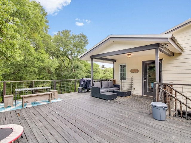 wooden terrace featuring an outdoor hangout area