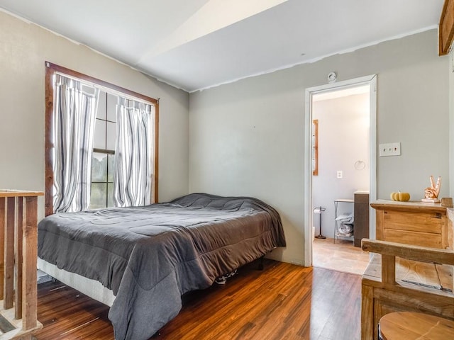 bedroom with wood finished floors