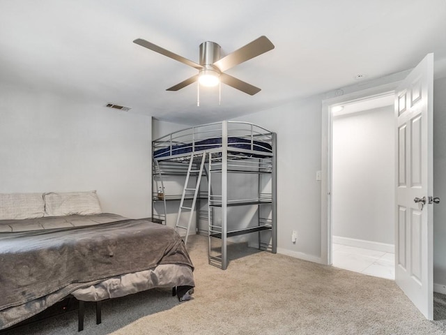 bedroom with baseboards, ceiling fan, carpet, and visible vents