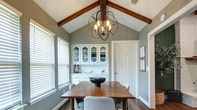 dining space with plenty of natural light, dark wood finished floors, and beam ceiling
