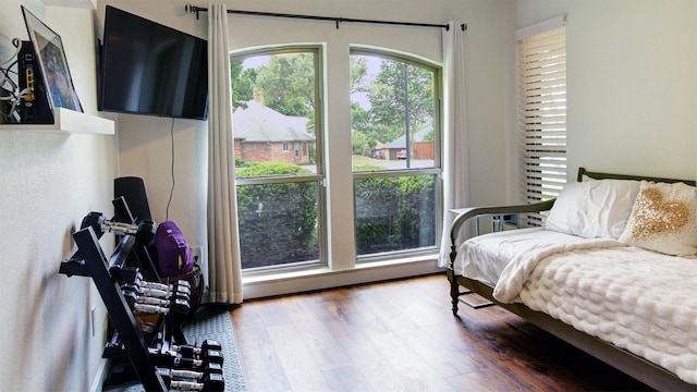 bedroom with wood finished floors