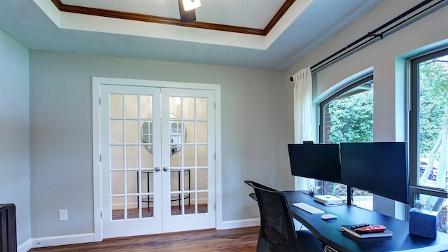 office space with french doors, baseboards, wood finished floors, and a tray ceiling