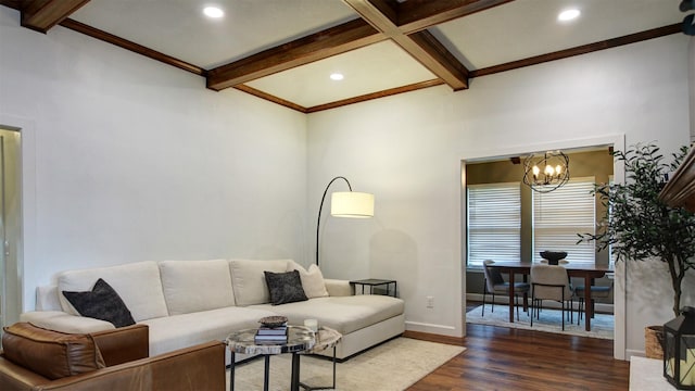 living room with an inviting chandelier, recessed lighting, baseboards, wood finished floors, and beamed ceiling