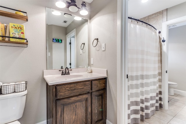 bathroom with vanity, toilet, tile patterned floors, a shower with shower curtain, and visible vents