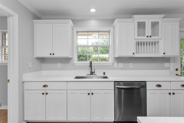 414 Jolee St, Richardson, TX 75080 - kitchen with white cabinets, crown molding, a sink, dishwasher, and light countertops