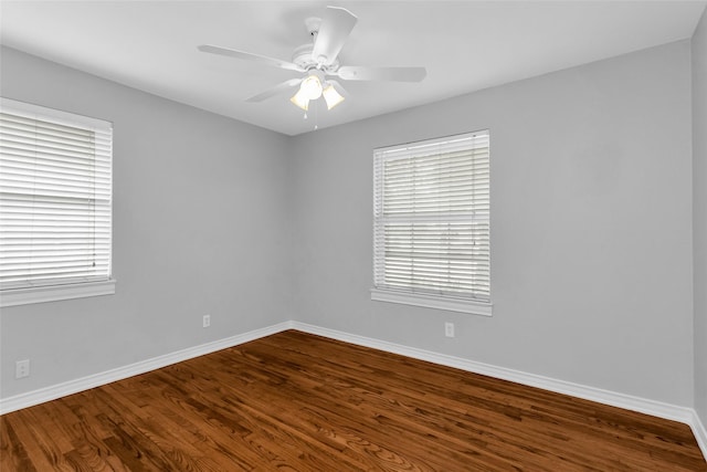 414 Jolee St, Richardson, TX 75080 - spare room featuring baseboards, a ceiling fan, and dark wood-style floors