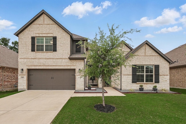 traditional home with concrete driveway, an attached garage, a front yard, and brick siding
