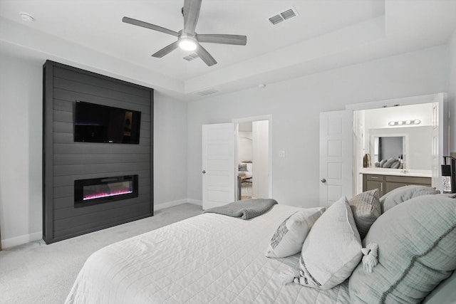 bedroom featuring baseboards, visible vents, and light carpet