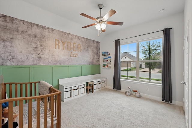 bedroom featuring baseboards, ceiling fan, and carpet