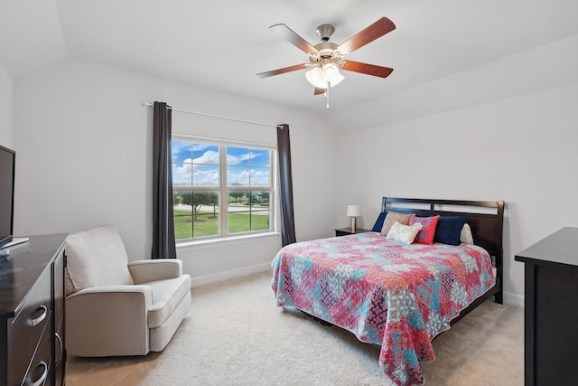 bedroom with baseboards, a ceiling fan, lofted ceiling, and light colored carpet