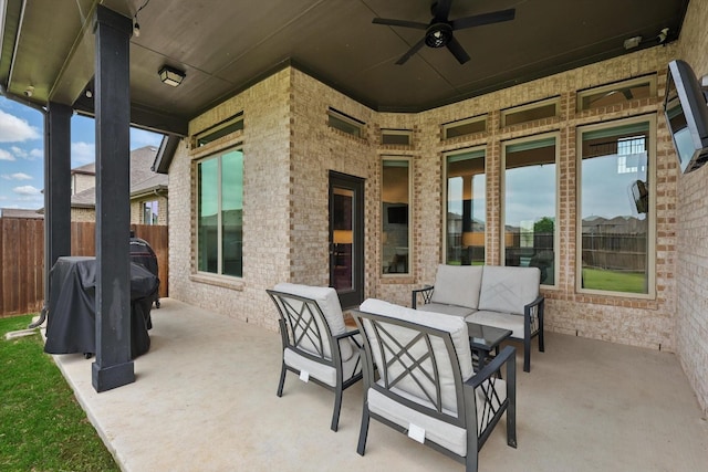 view of patio / terrace with ceiling fan, fence, grilling area, and an outdoor hangout area