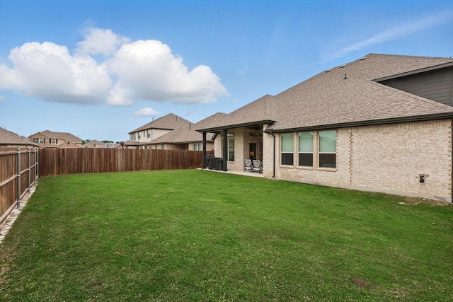 view of yard with a fenced backyard and a patio area