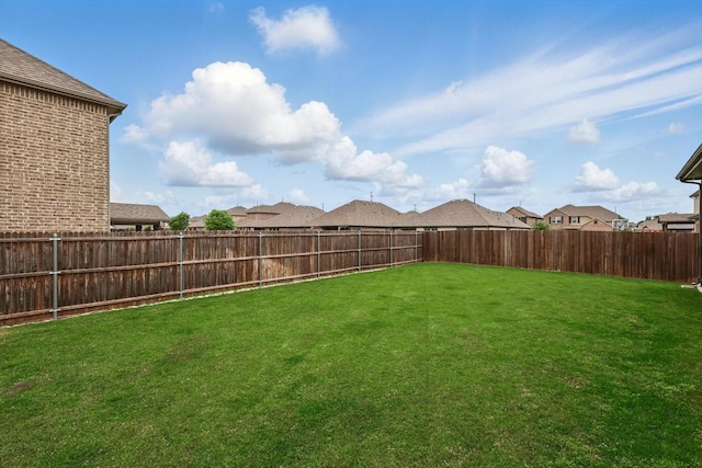 view of yard featuring a fenced backyard