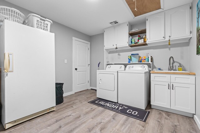 walk in closet with visible vents and wood finished floors