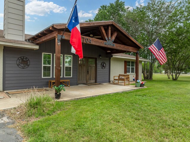 view of yard featuring fence and a patio