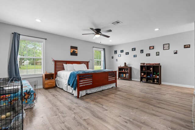 kitchen with stainless steel appliances, visible vents, a breakfast bar, and light wood-style floors
