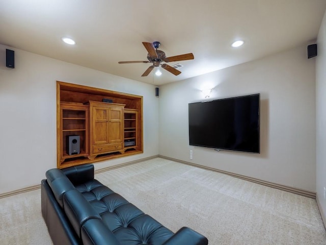 carpeted living room featuring baseboards, ceiling fan, and recessed lighting