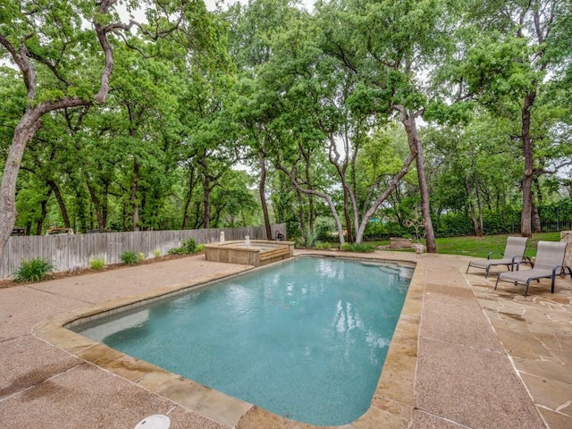 view of pool with a fenced in pool, a patio, and a fenced backyard