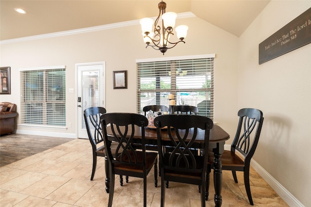dining space featuring an inviting chandelier, ornamental molding, baseboards, and lofted ceiling