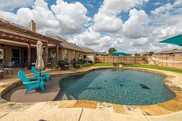 view of pool featuring a fenced in pool, a fenced backyard, and a patio area